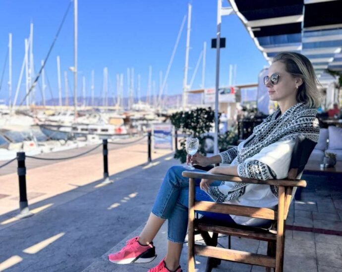Relaxing at a marina café in Cyprus with yachts and sea views