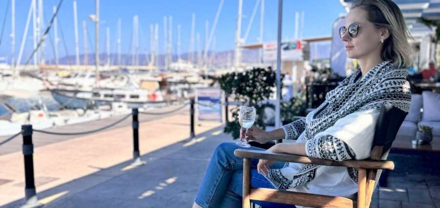 Relaxing at a marina café in Cyprus with yachts and sea views